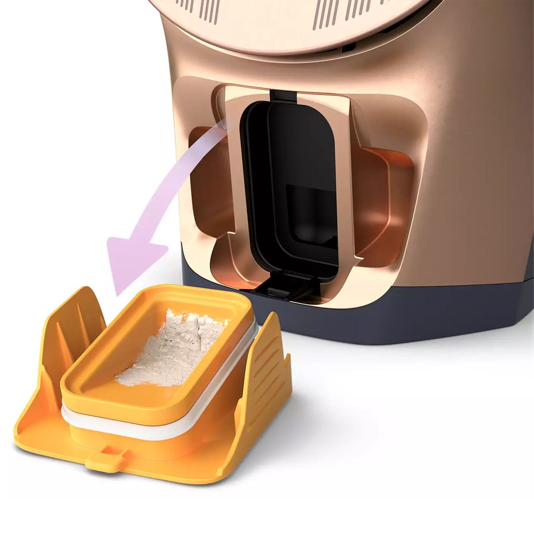 A steam iron with a removable tray containing white powder, on a white background
