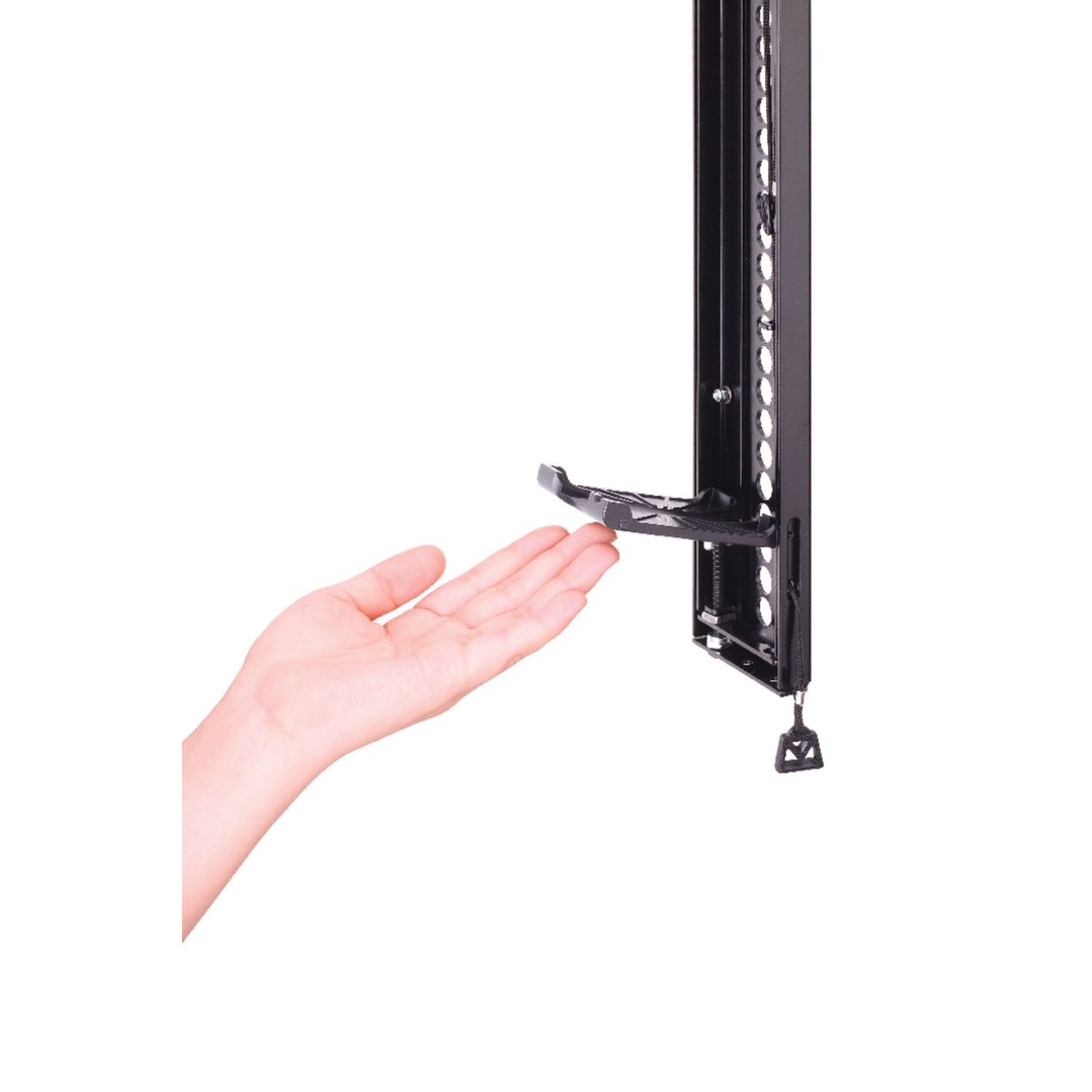 Hand interacting with a black tv wall mount on a white background