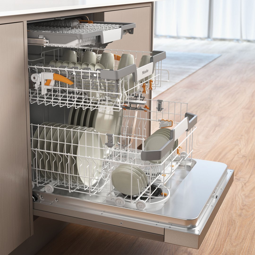 Open dishwasher with racks full of dishes in a kitchen setting