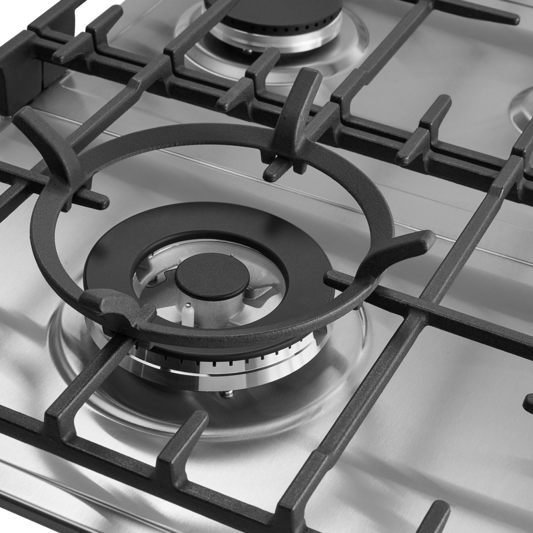 Close up of a stainless steel gas cooktop with black grates