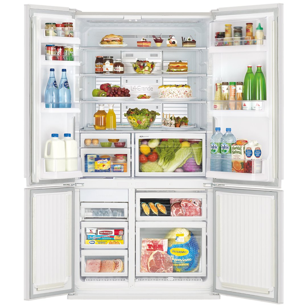 Open French door refrigerator filled with food and drinks in a kitchen setting