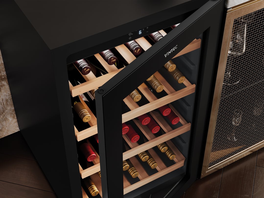 Black Vintec wine cabinet with glass door open, showing wine bottles inside