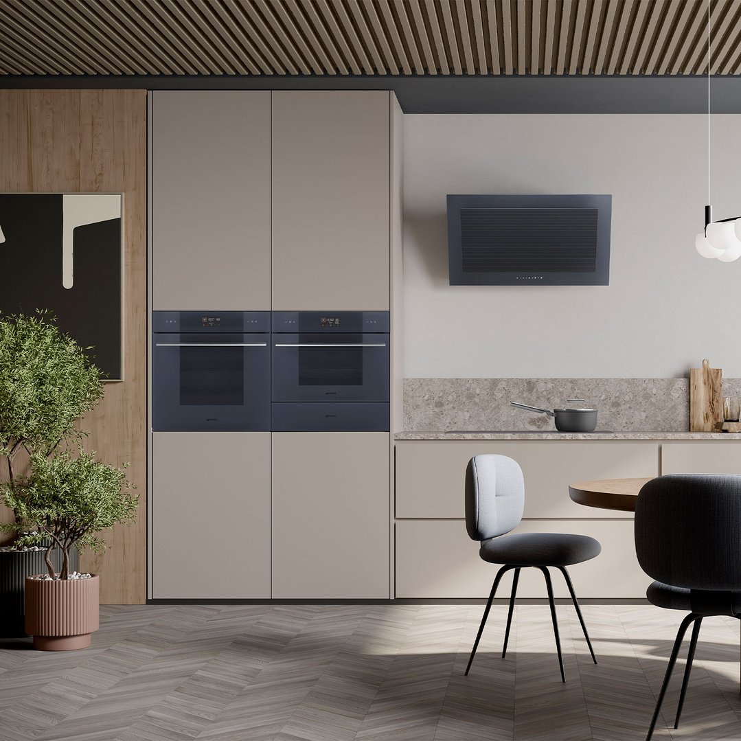 Two built-in ovens in a modern kitchen with dining area