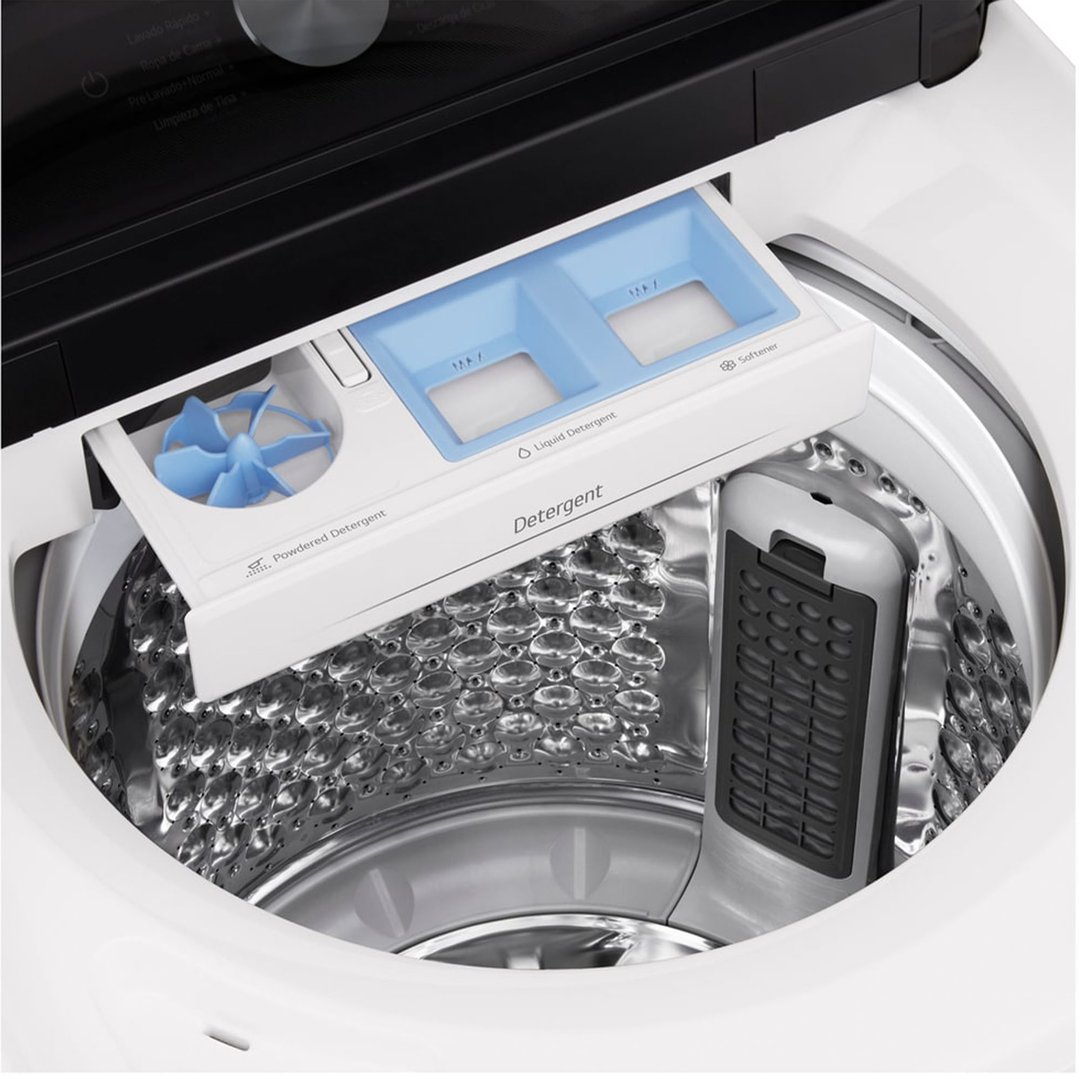 Close-up of the top-load washing machine's detergent dispenser and drum