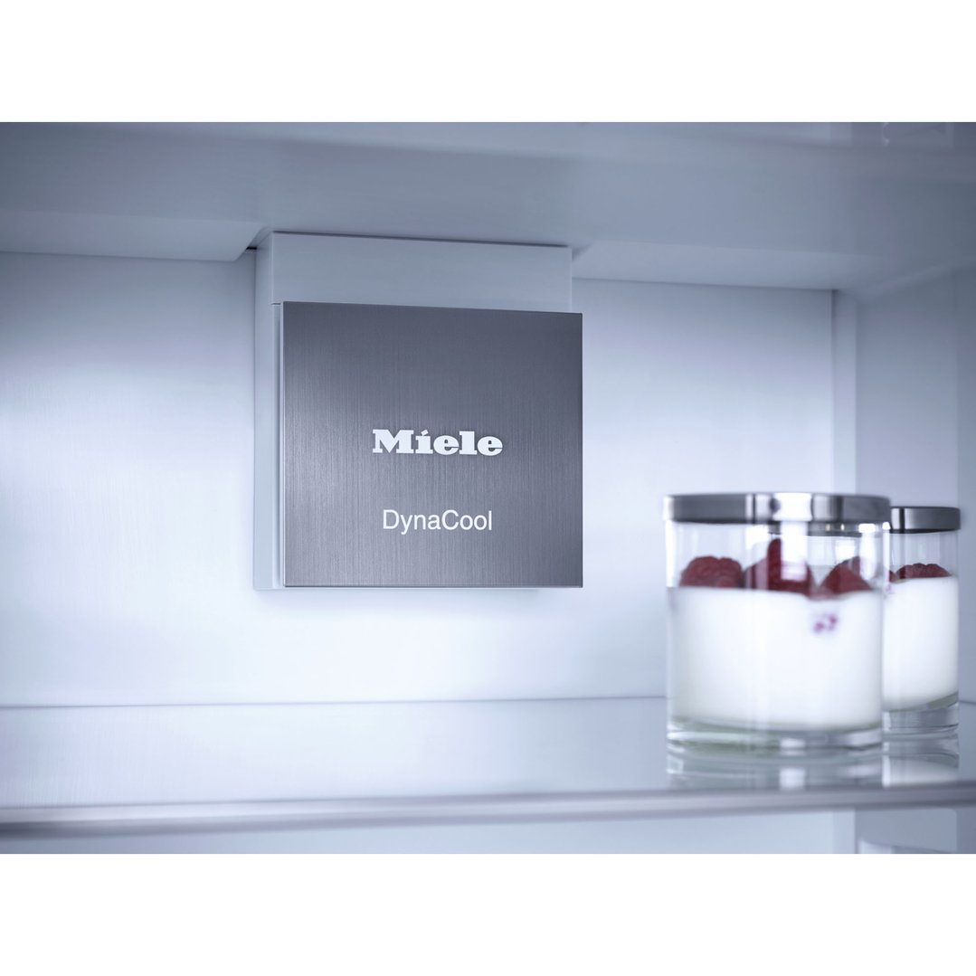 Interior of a Miele fridge with DynaCool feature and two jars of yogurt