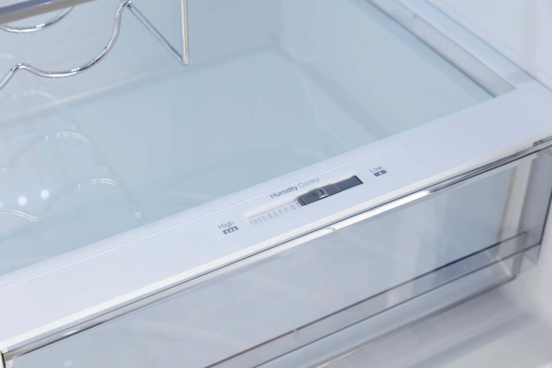 Close up of the humidity control slider inside a fridge drawer