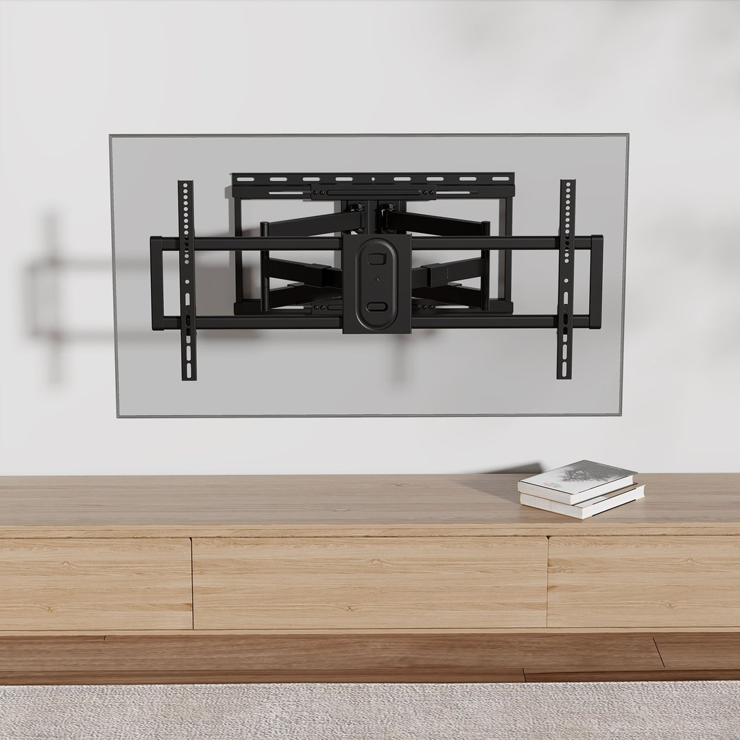 Full motion TV wall mount installed on a wall above a wooden cabinet
