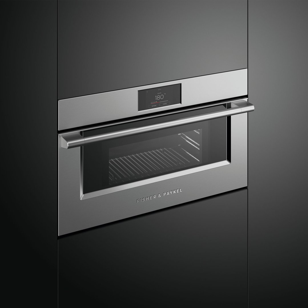 Built-in stainless steel microwave oven with digital display in a dark kitchen