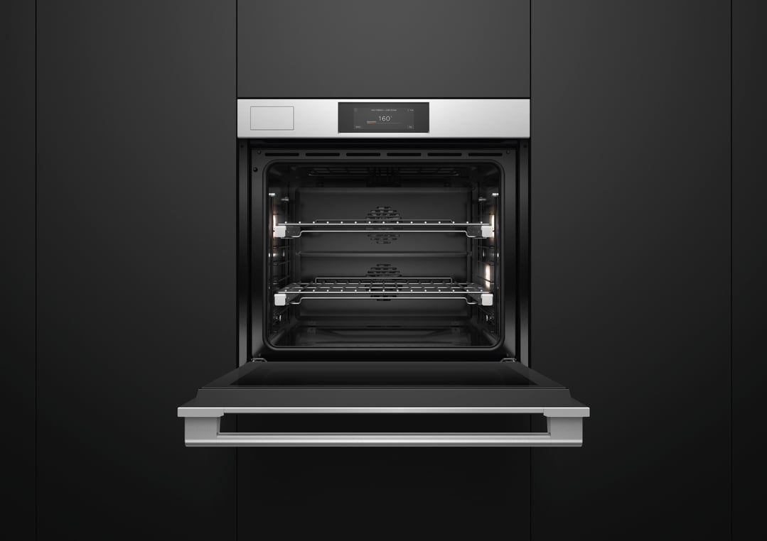 Built-in stainless steel oven with door open, displaying interior racks and controls