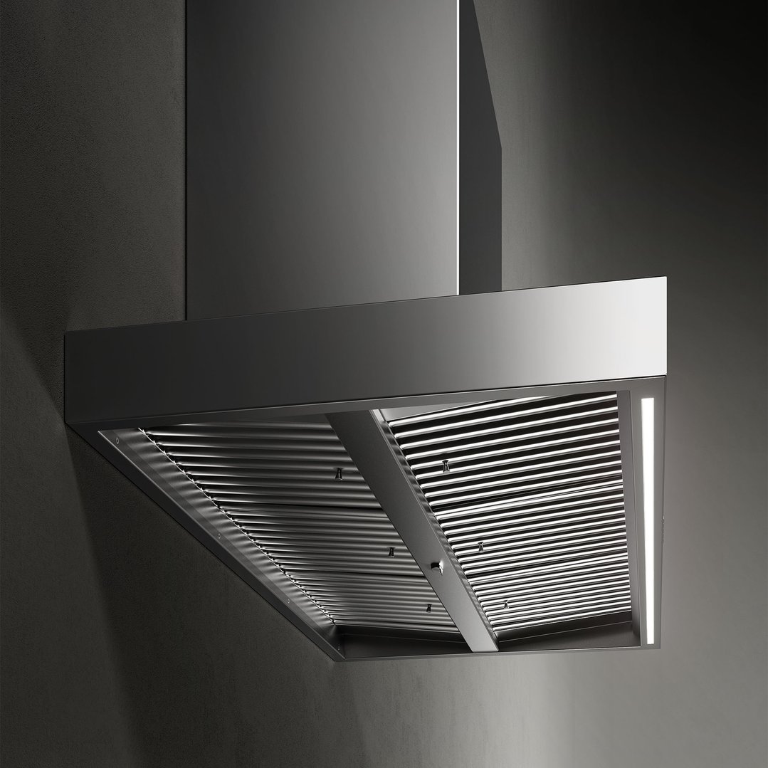 Stainless steel rangehood with internal grates and LED lighting against a dark wall