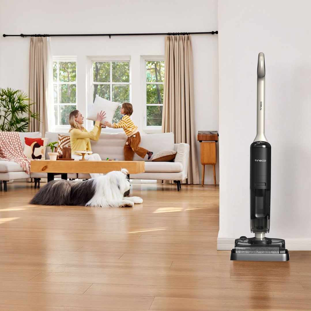 Tineco iFloor U5 Stretch vacuum cleaner in a living room with a family
