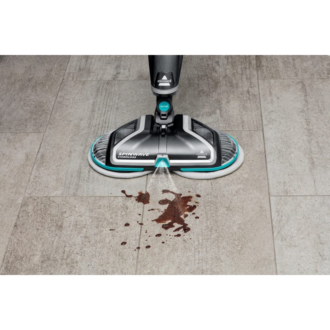BISSELL SpinWave Cordless steamMop cleaning a spill on a tiled floor