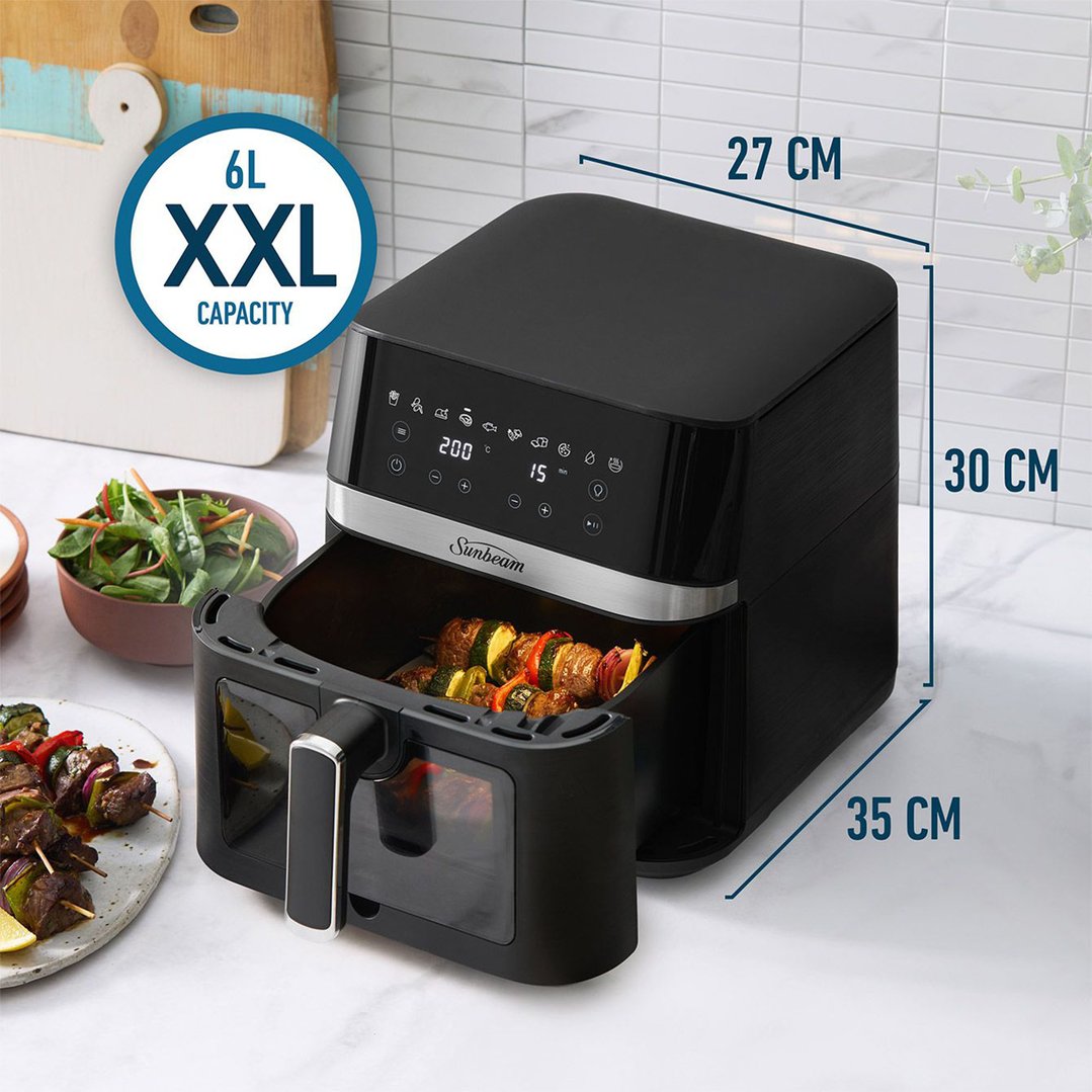Black Sunbeam air fryer with food inside, on a kitchen counter with dimensions