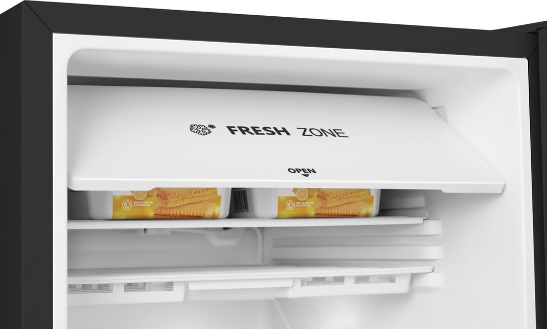 Close-up of the open fresh zone compartment inside a black bar fridge