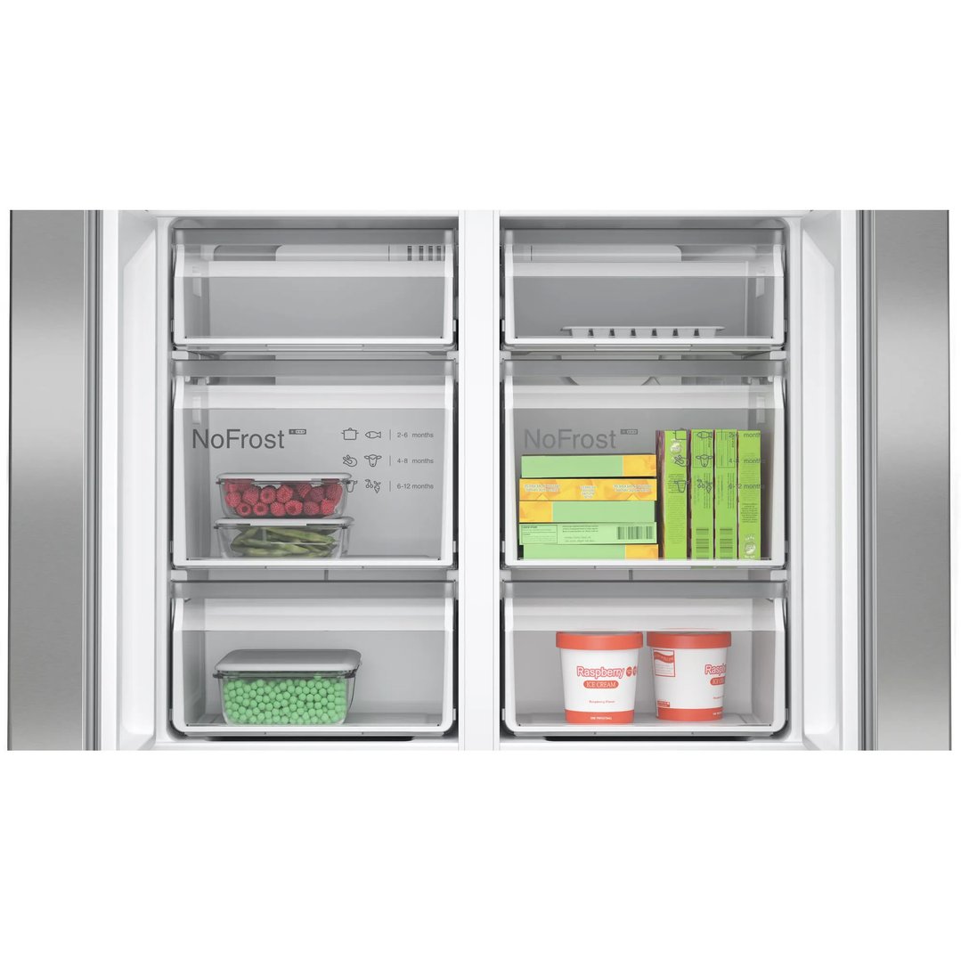 Open freezer drawers of a French door bottom freezer with food items inside