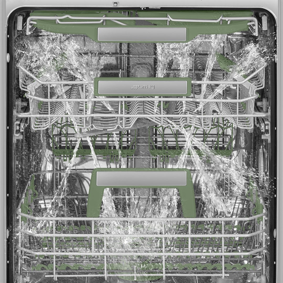 Dishwasher interior with water spraying during a wash cycle