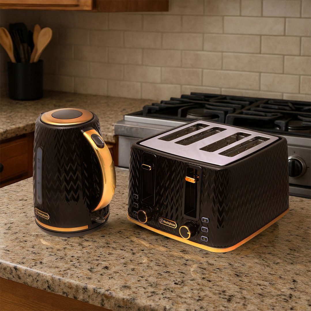 Black and gold kettle and toaster on a granite kitchen countertop
