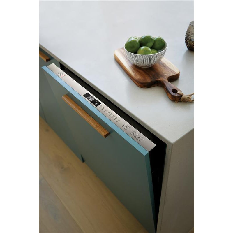 Integrated dishwasher with control panel visible, partially open in a kitchen