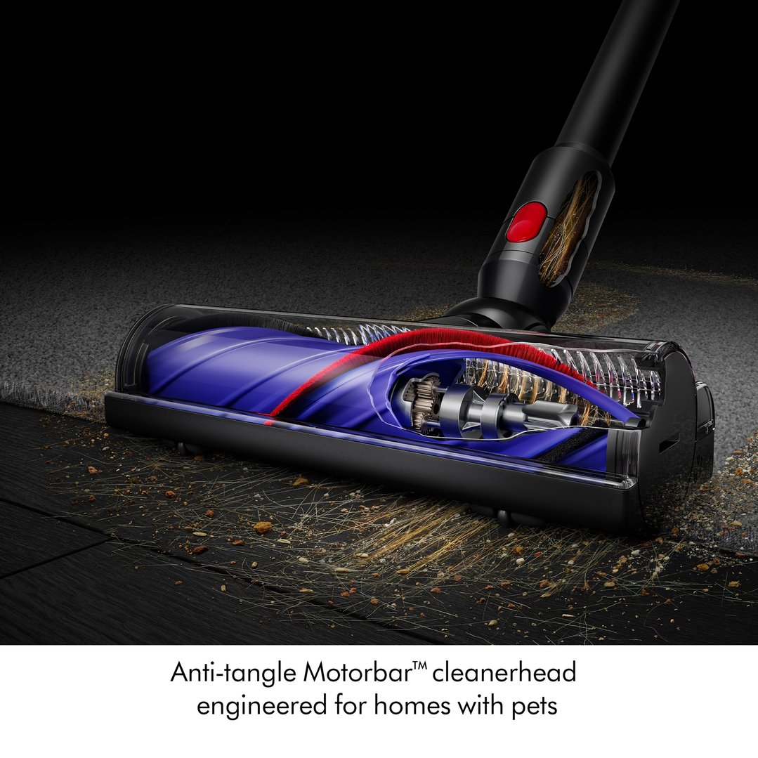 Cordless vacuum cleaner head with anti-tangle motorbar cleaning a carpet and wooden floor