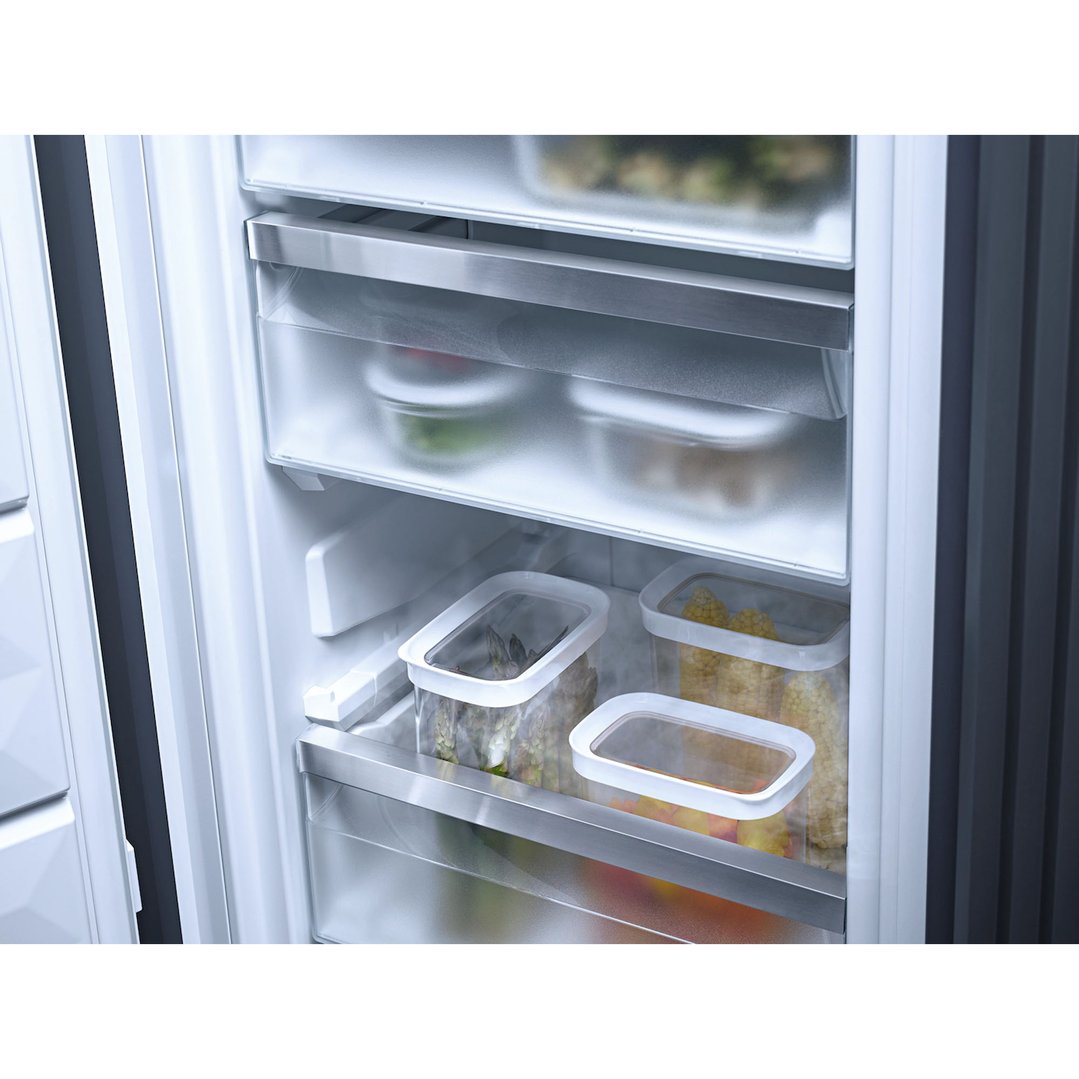 Interior view of a freezer with various food containers on shelves