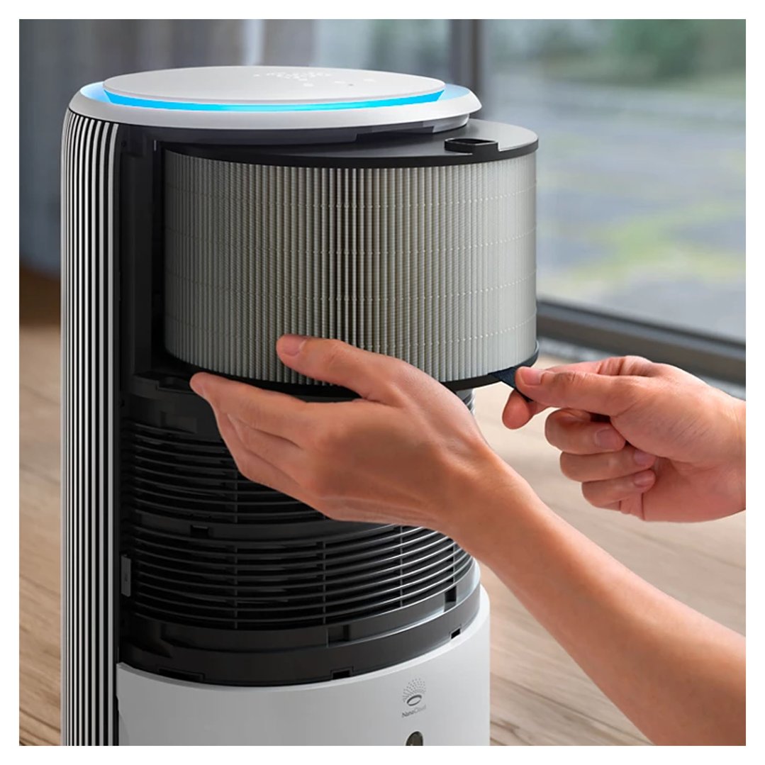 Hands removing the filter from a Philips air purifier
