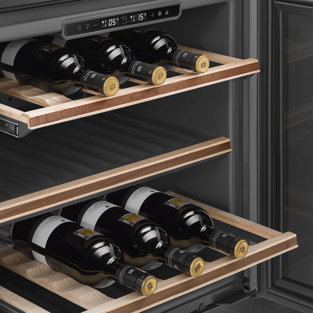Close up of a wine cellar interior with bottles on wooden shelves