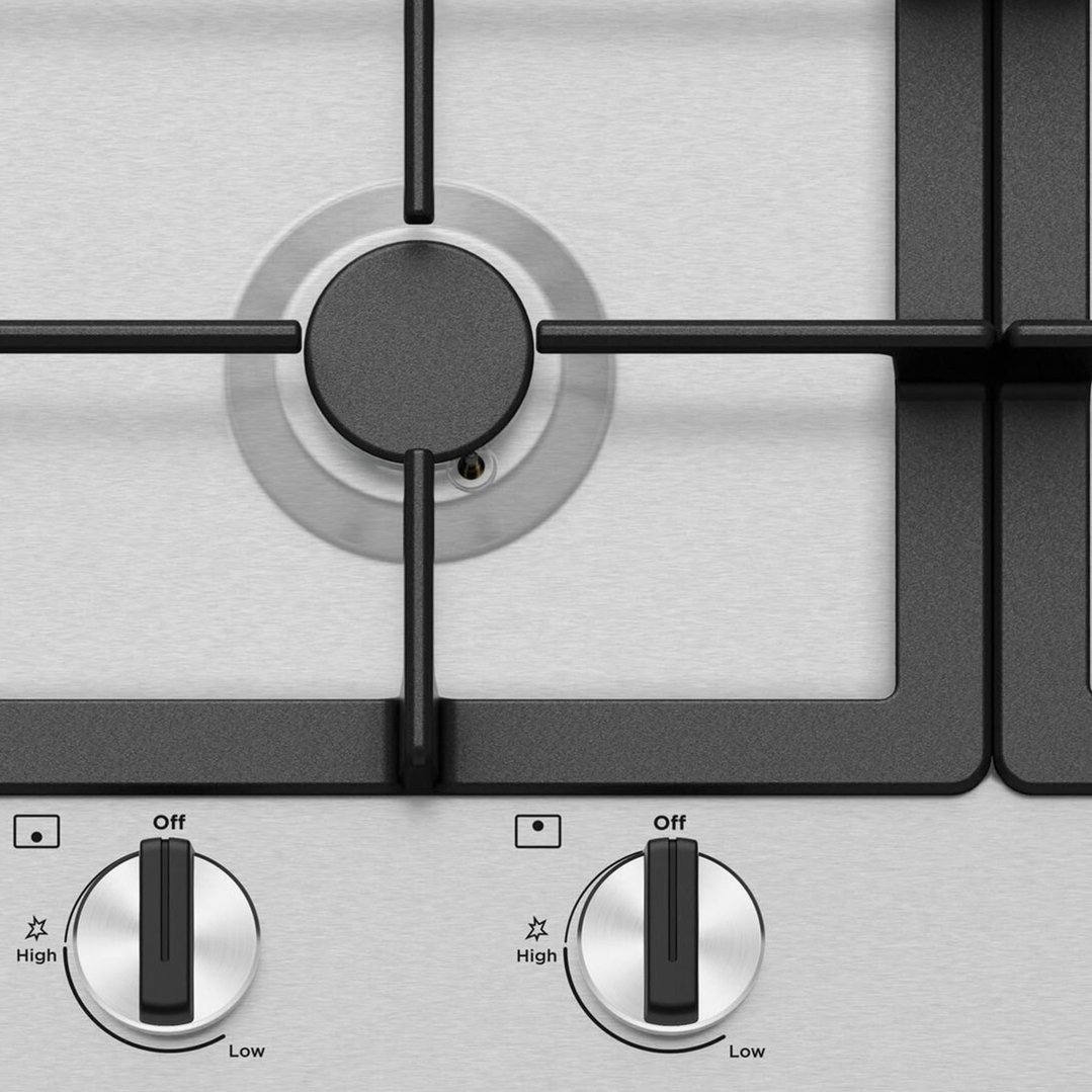 Close-up overhead view of a gas cooktop with two control knobs