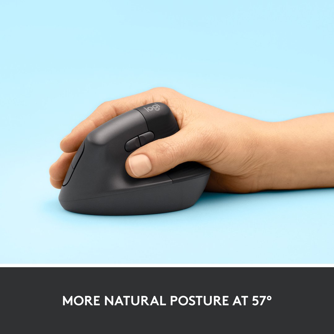 Hand holding a dark grey Logitech Lift Vertical Ergonomic Mouse on a blue background