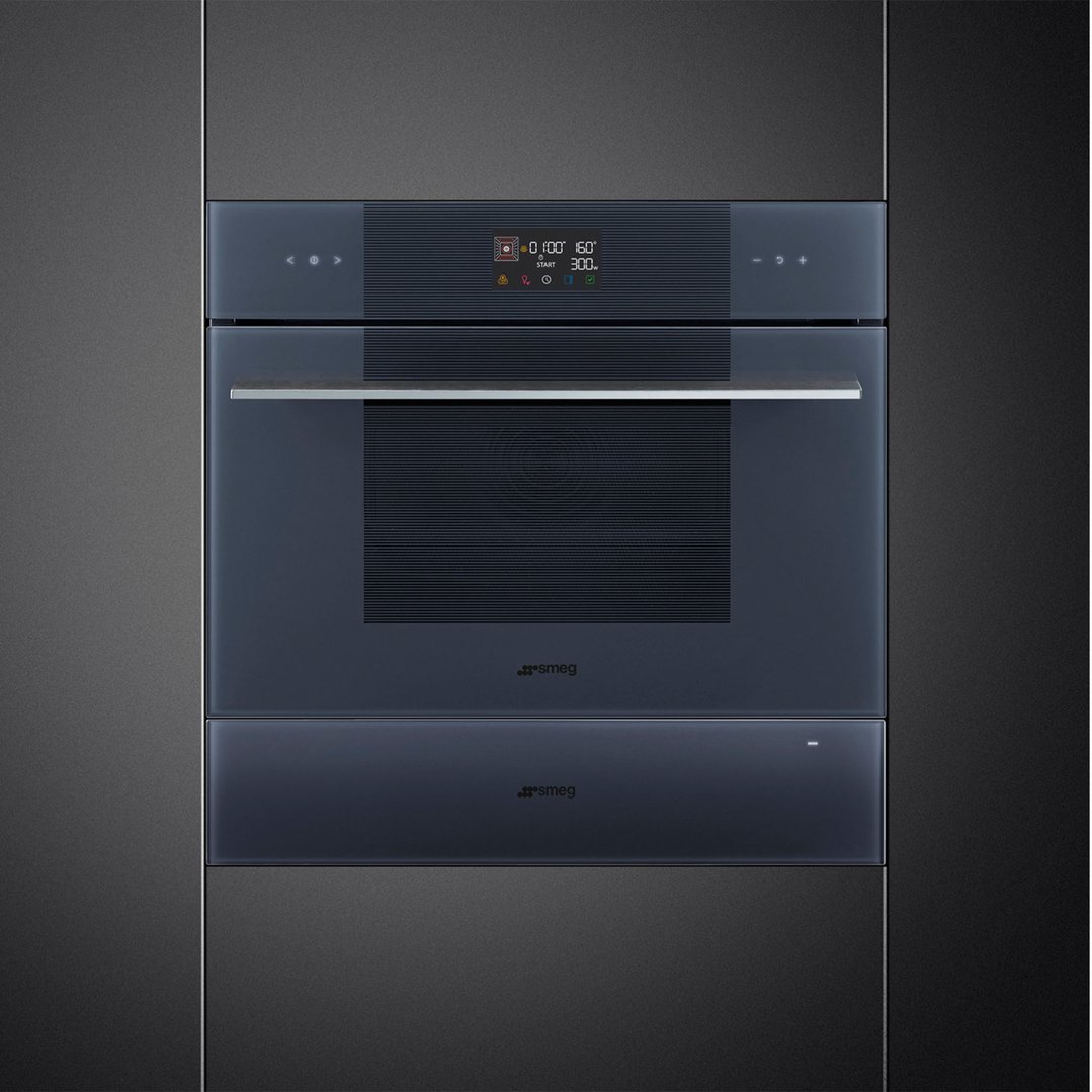 Built-in warming drawer and oven in a dark kitchen cabinet