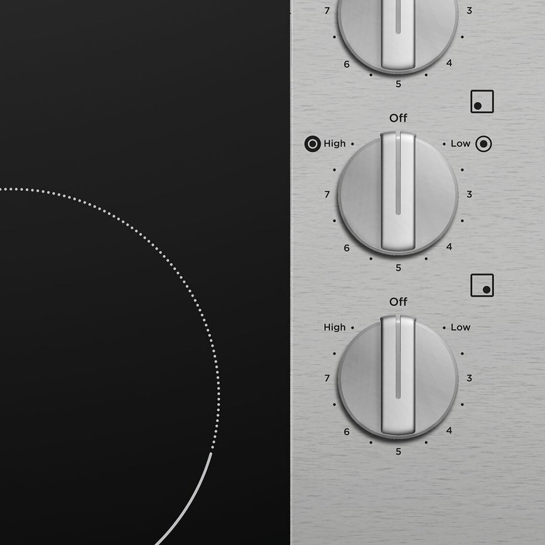 Close up of the cooktop controls with two dials set to different heat levels