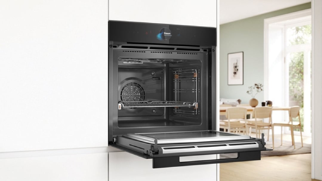 Built-in oven with microwave and steam function in a modern kitchen setting