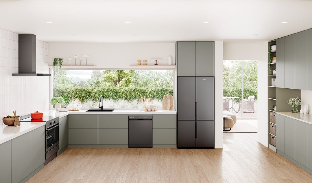 A 564L Quad Door Fridge in a modern kitchen with light green cabinetry