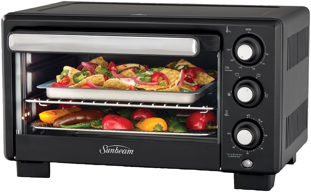 Black Sunbeam air fryer oven with nachos and vegetables inside