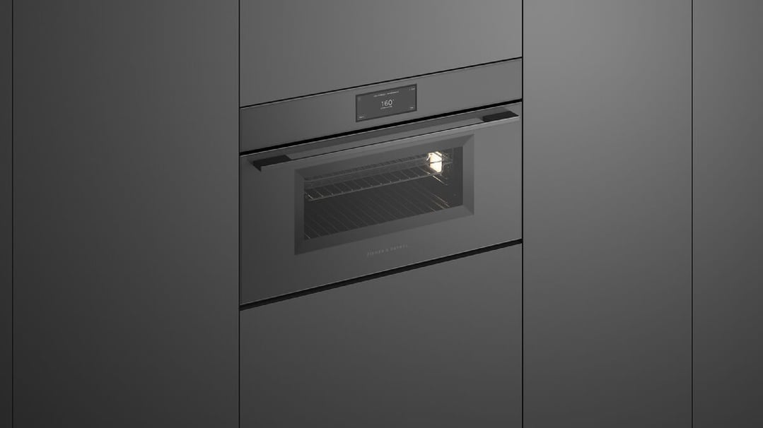 Built-in grey glass compact combi-steam oven with interior light on