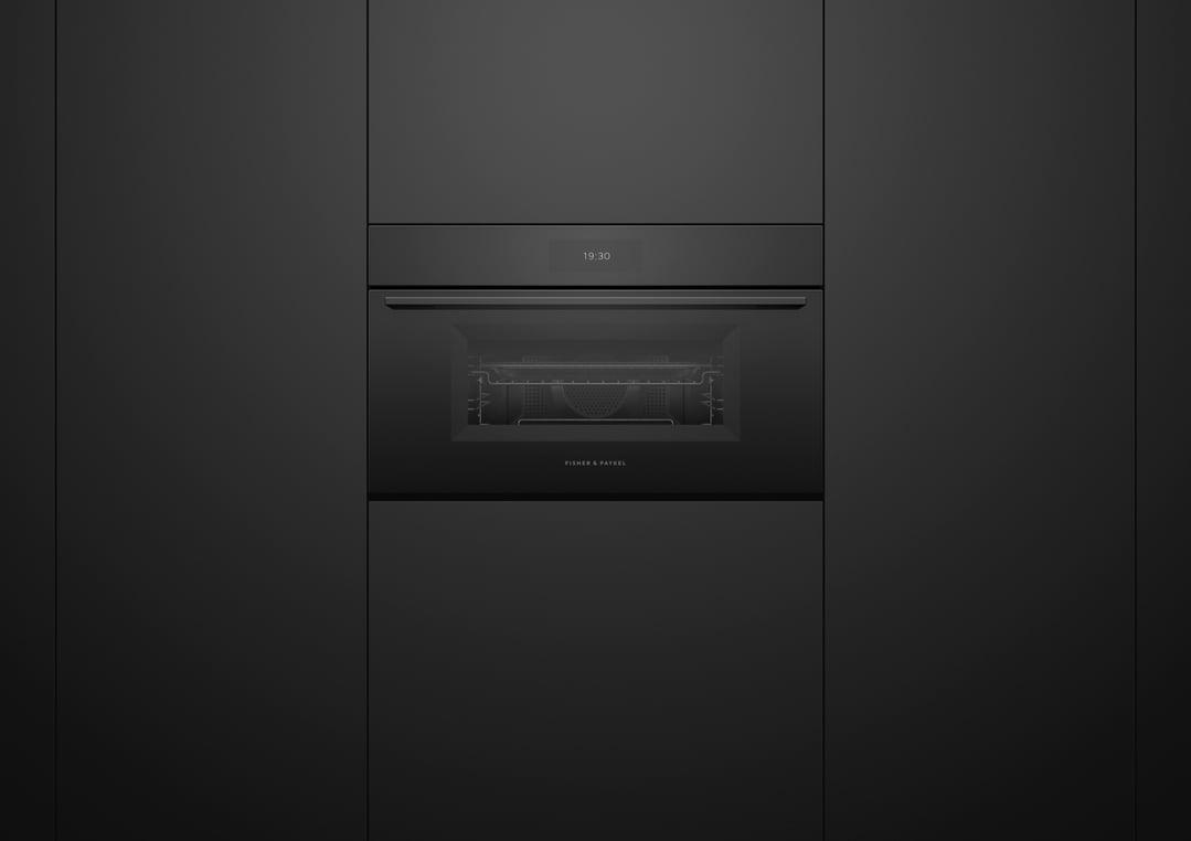 Built-in black compact combi-microwave oven with digital display showing 19:30