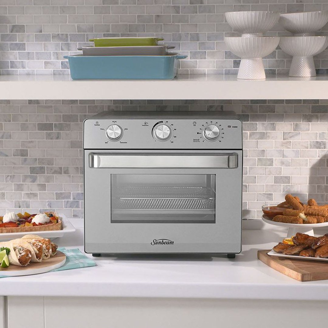 Sunbeam Multi Function Oven + Air Fryer on a kitchen counter with food
