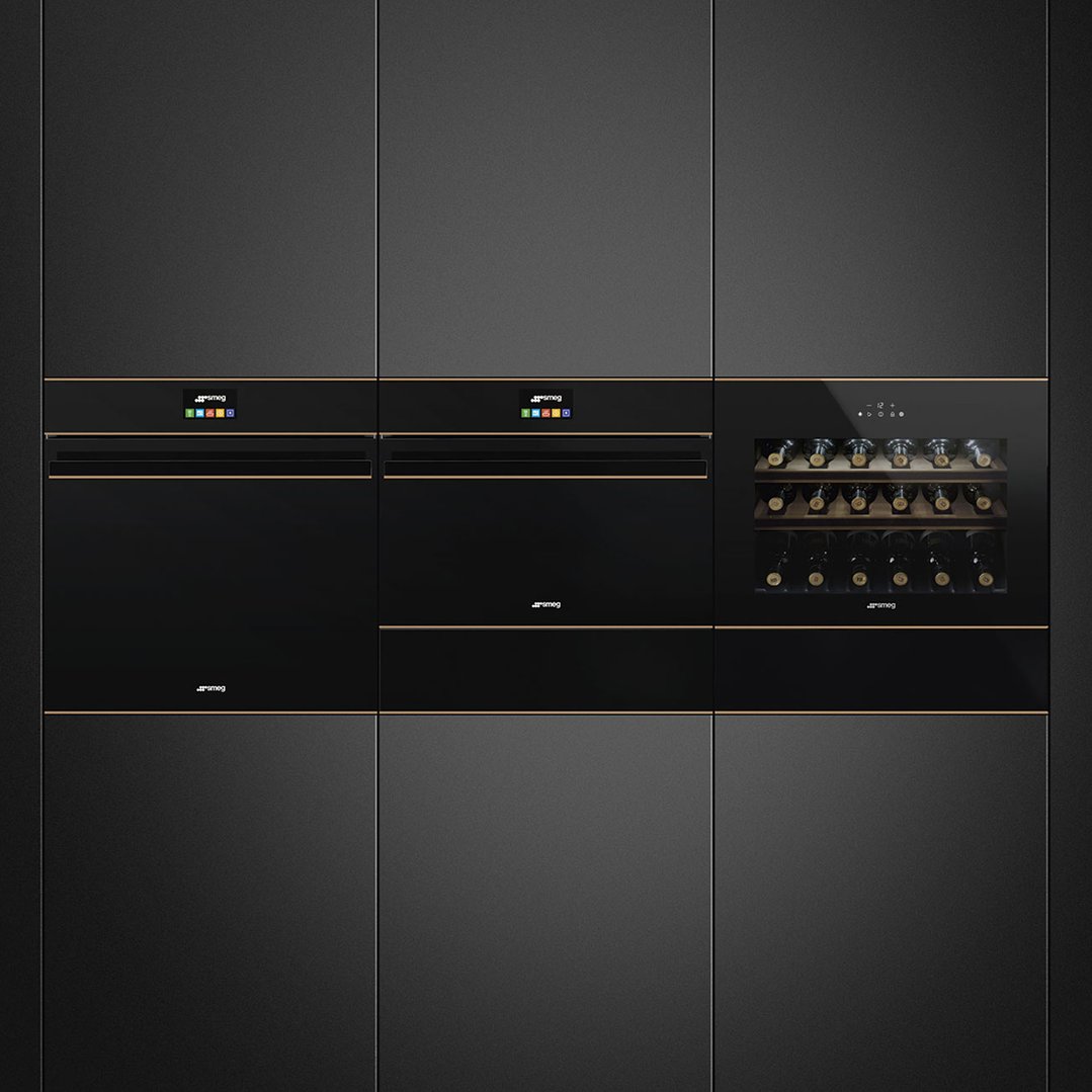 Three built-in appliances, including a wine cabinet, in a dark kitchen setting