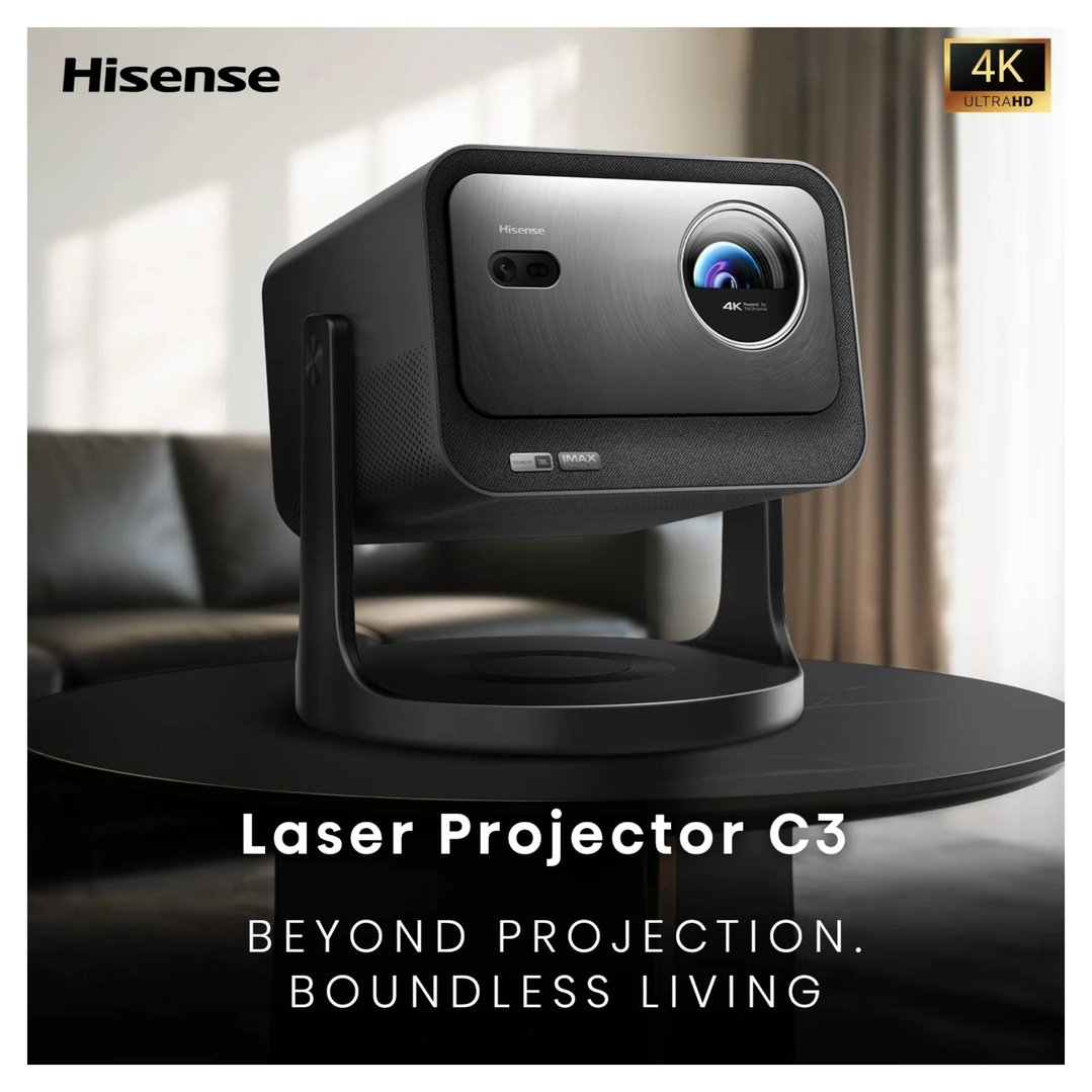 Hisense laser projector on a black table in a living room setting