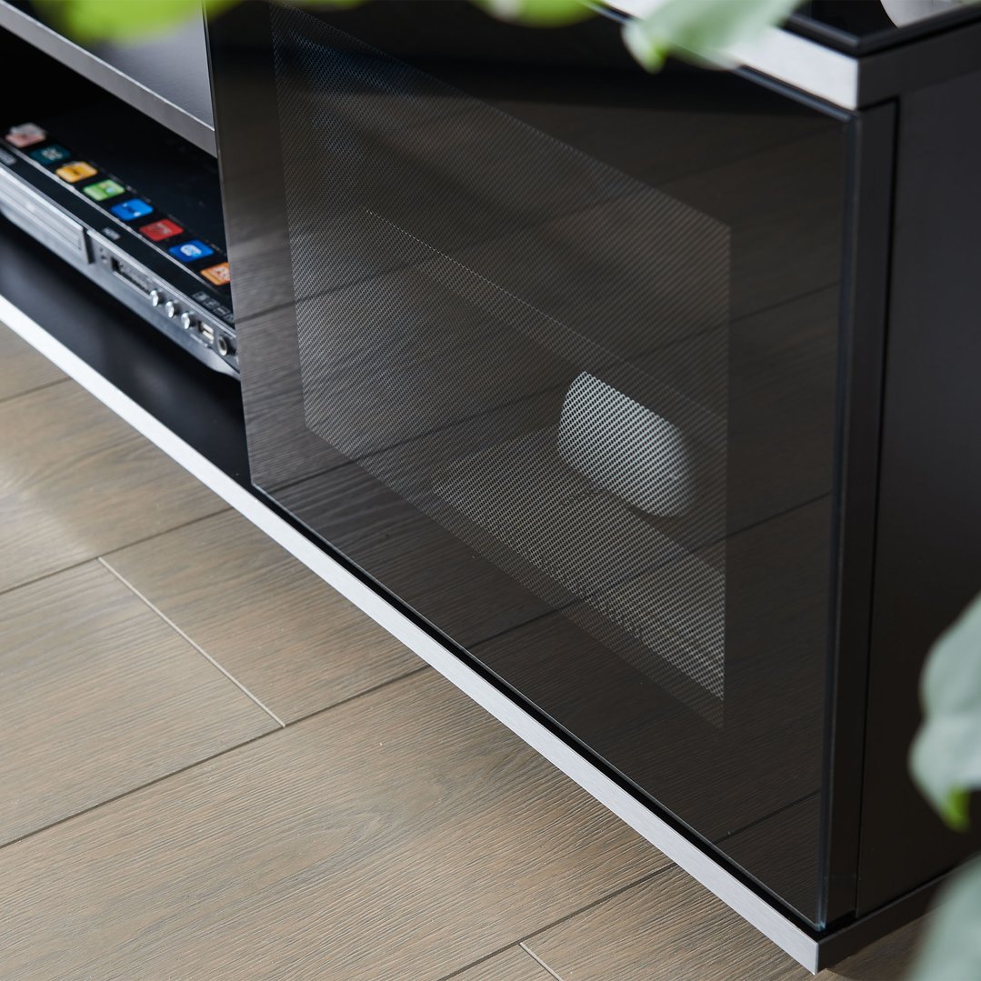 Close up of a black TV cabinet with a DVD player inside
