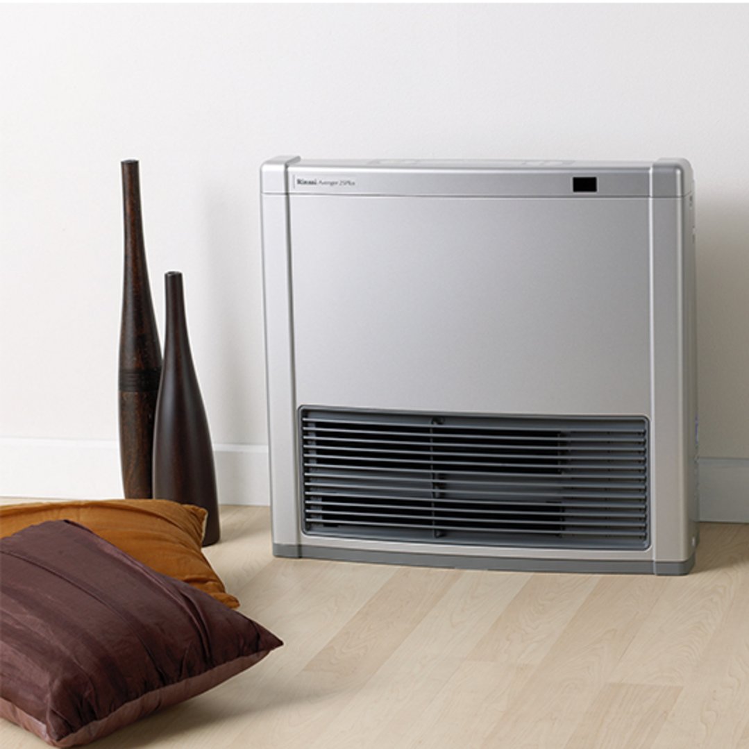 Silver Rinnai Avenger 25 convector heater on a wooden floor with decorative vases and cushions