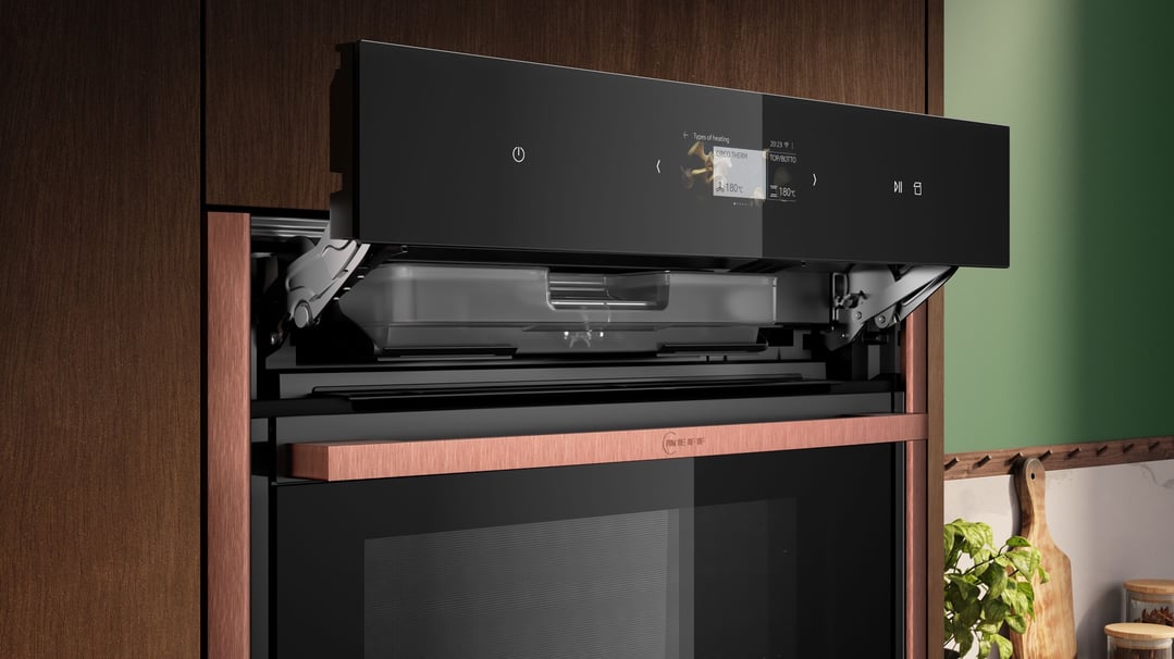 Built-in oven with control panel open in a kitchen setting