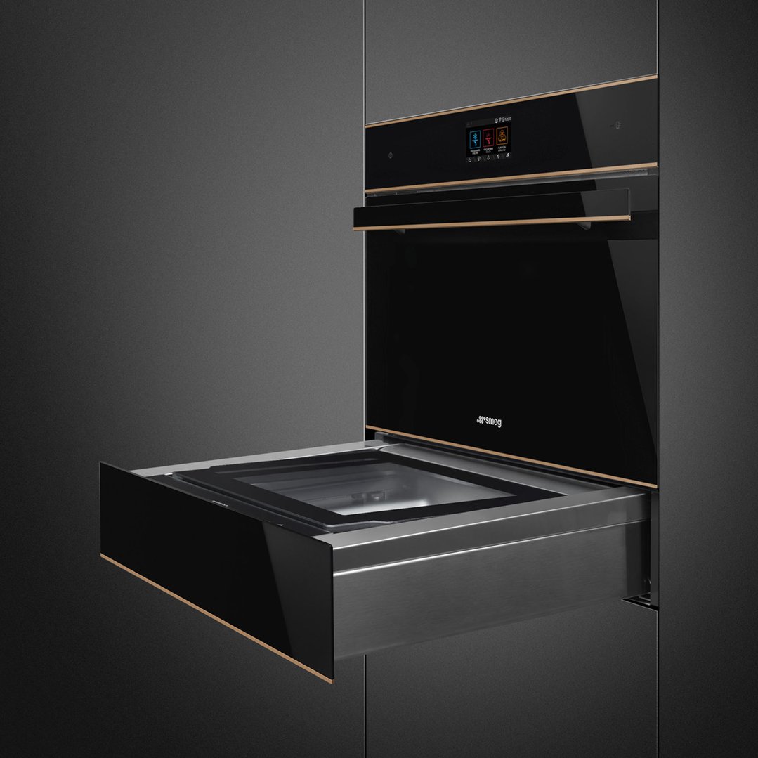 Dolce Stil Novo 45cm Compact Blast Chiller with drawer open in a dark kitchen