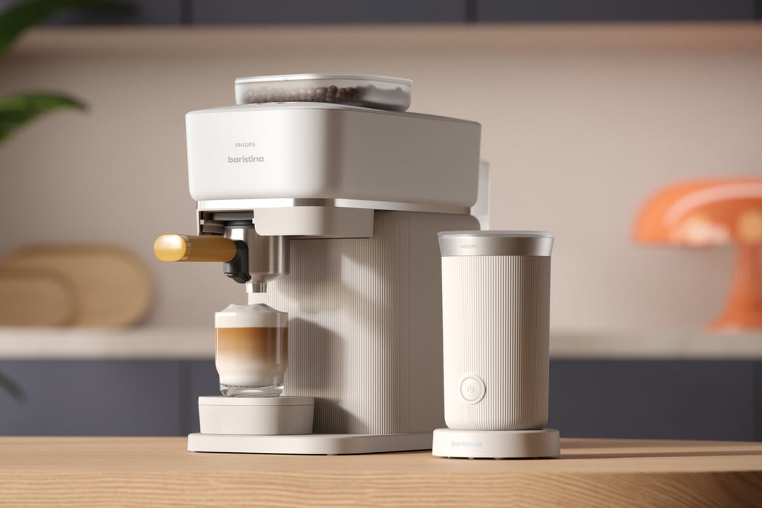 Philips Baristina coffee machine and milk frother on a wooden counter