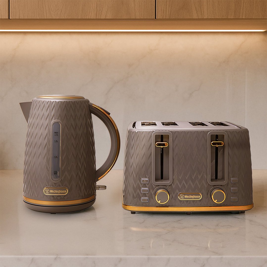 Grey and gold kettle and toaster set on a kitchen counter