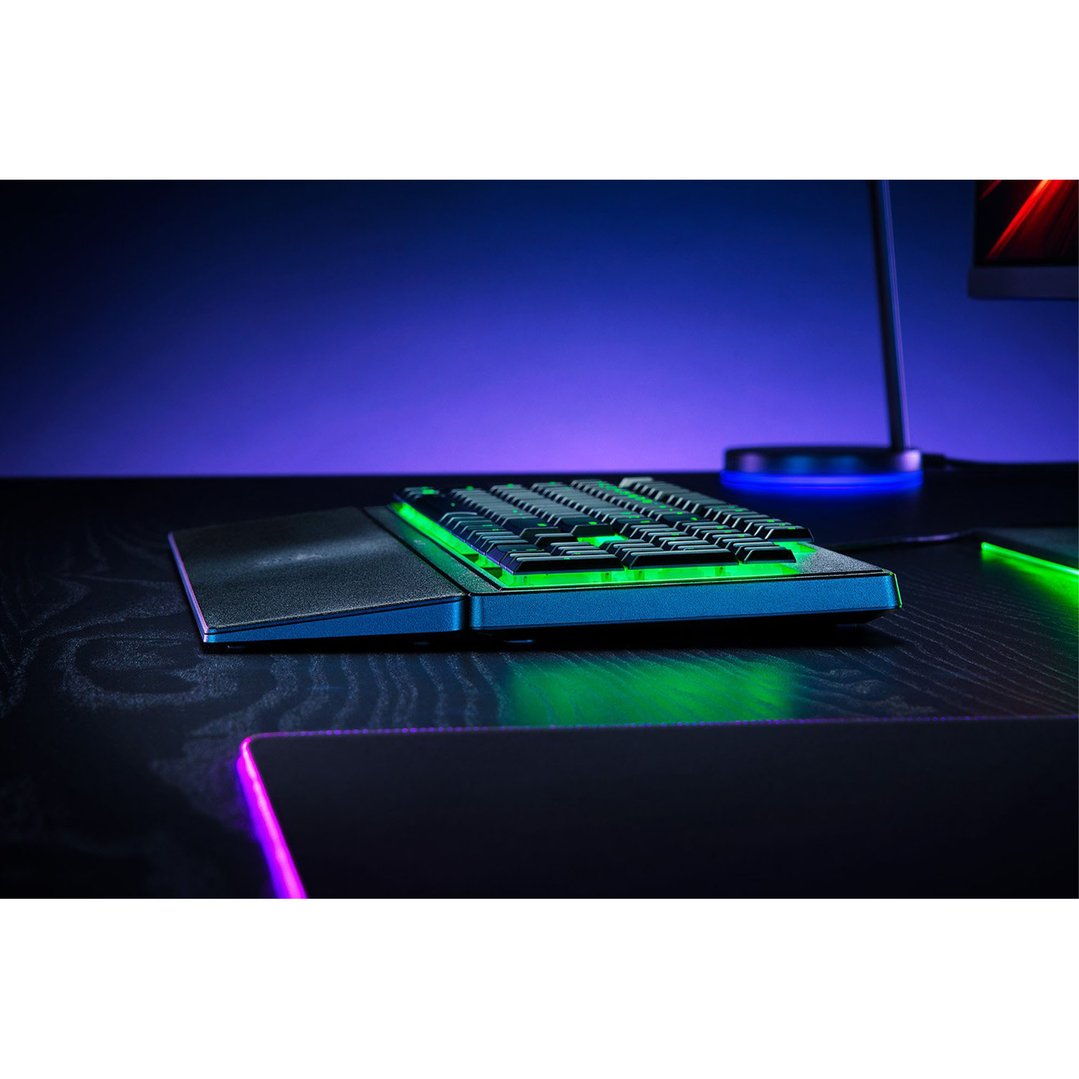 Razer Ornata V3 X Gaming Keyboard with green backlighting on a dark desk