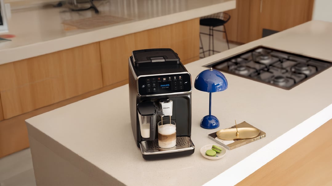 Philips Series 4400 Fully Automatic Espresso Machine making coffee in a kitchen