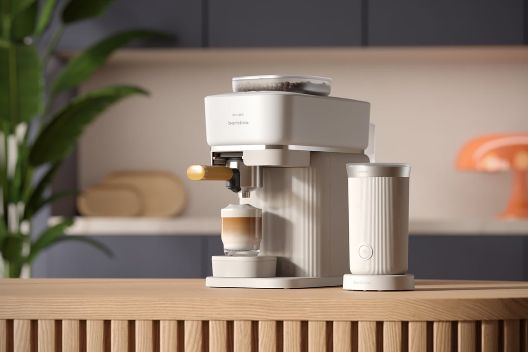 Philips Baristina coffee machine and milk frother on a wooden counter