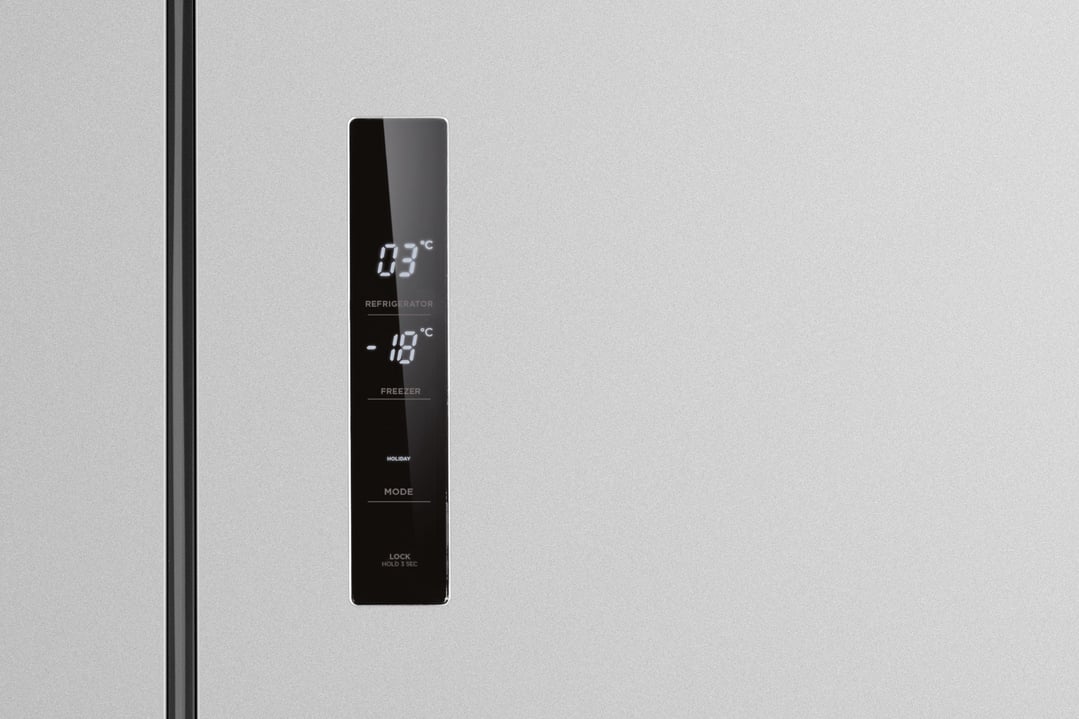 Close up of a refrigerator's digital display showing temperature settings