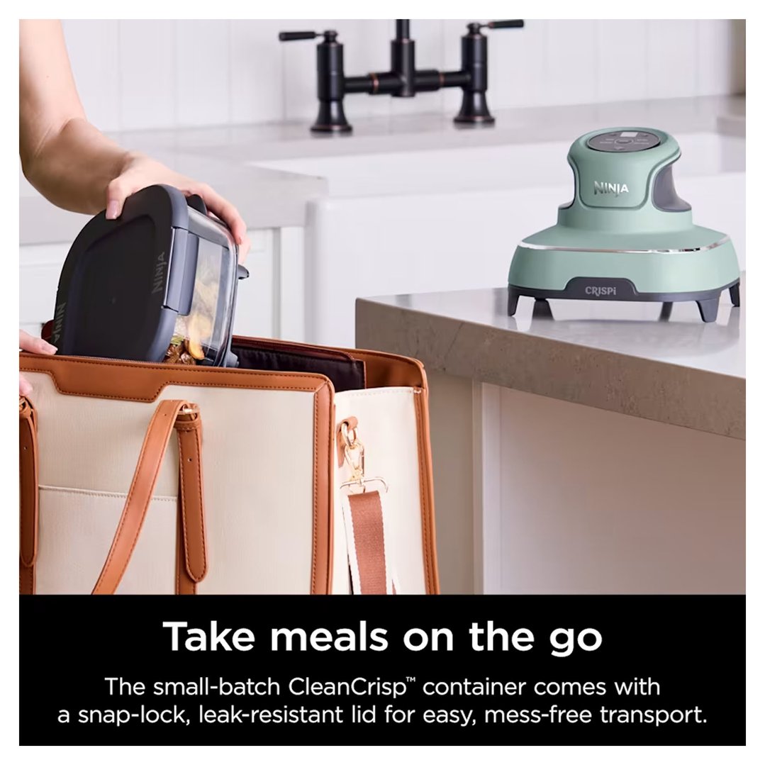 Person placing a food container into a bag next to a Ninja air fryer