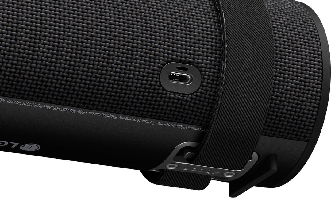 Close-up of the LG xboom Grab Portable Bluetooth Speaker showing charging port and strap